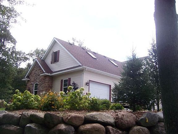 Side of home. House is on the 17th fairway of the golf course.