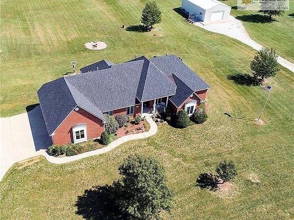 This country estate offers an oversized 3-car garage, cement driveway, basketball goal in backyard, and 30x50 metal outbuilding with 4.6+ acres...all on blacktop roads!