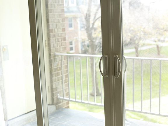 View off back patio. Trees and grass. Doesn_t face windows of other units.