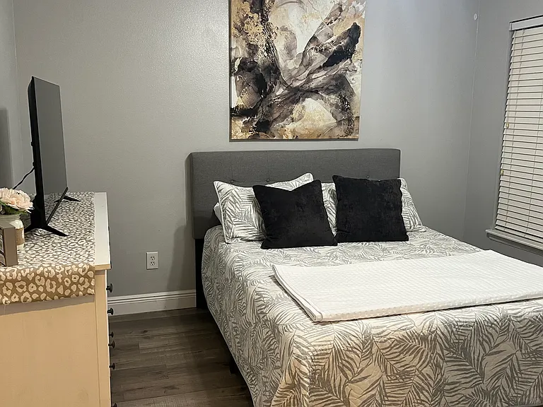 Queen-size bed and 50" TV included
