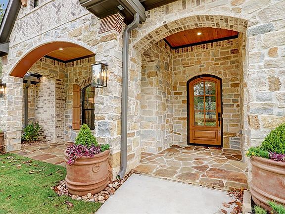 Extended covered front porch - even electrical outlets for your future Christmas lights within the soffits!