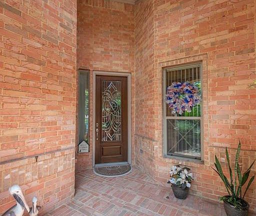 The bricked front porch gives you a hint of the treasures you will find inside!