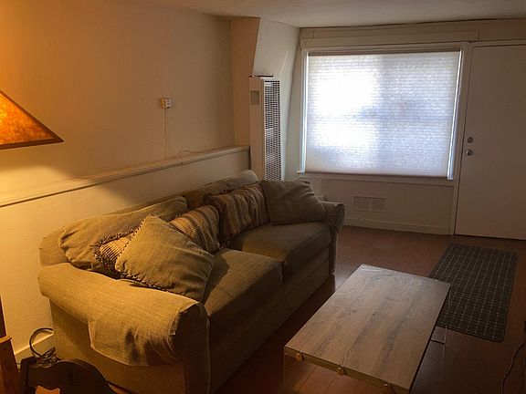 Living room with gas wall heater 10' x 16'. 7'2" ceiling.