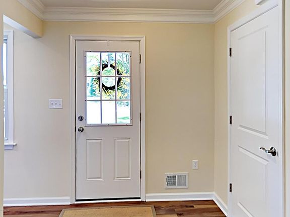 Front door and coat closet 