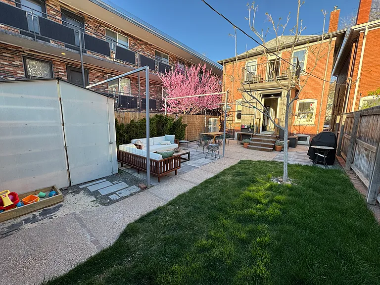Backyard featuring storage shed