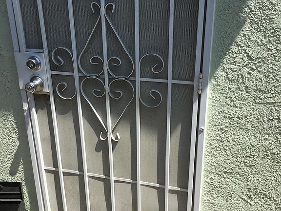 Double locked screen door with double locked door behind