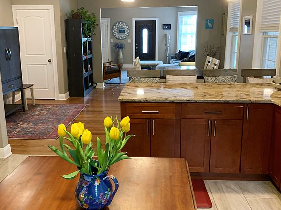 Open floor plan from kitchen to dining to living room