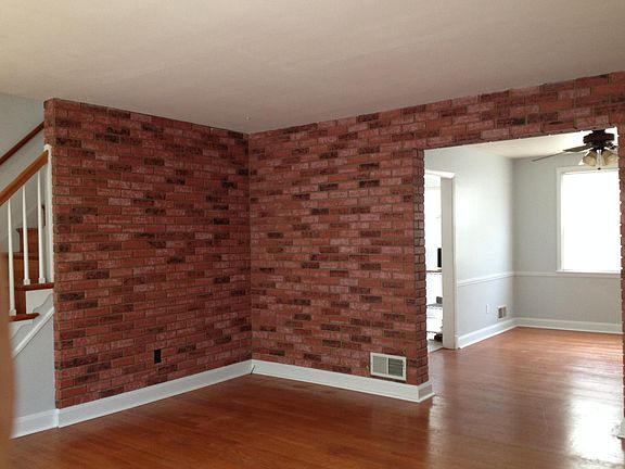 Living room - stairs to 2nd floor on left- view 2
