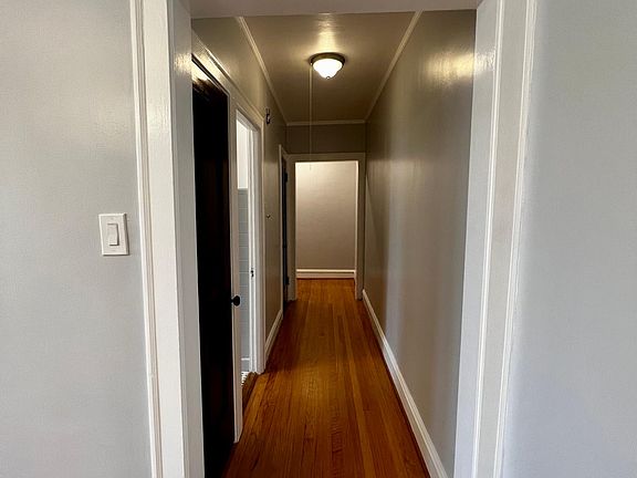 Hallway with multiple closets.