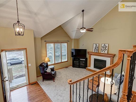 View from kitchen overlooking open floor plan with living room and entry.