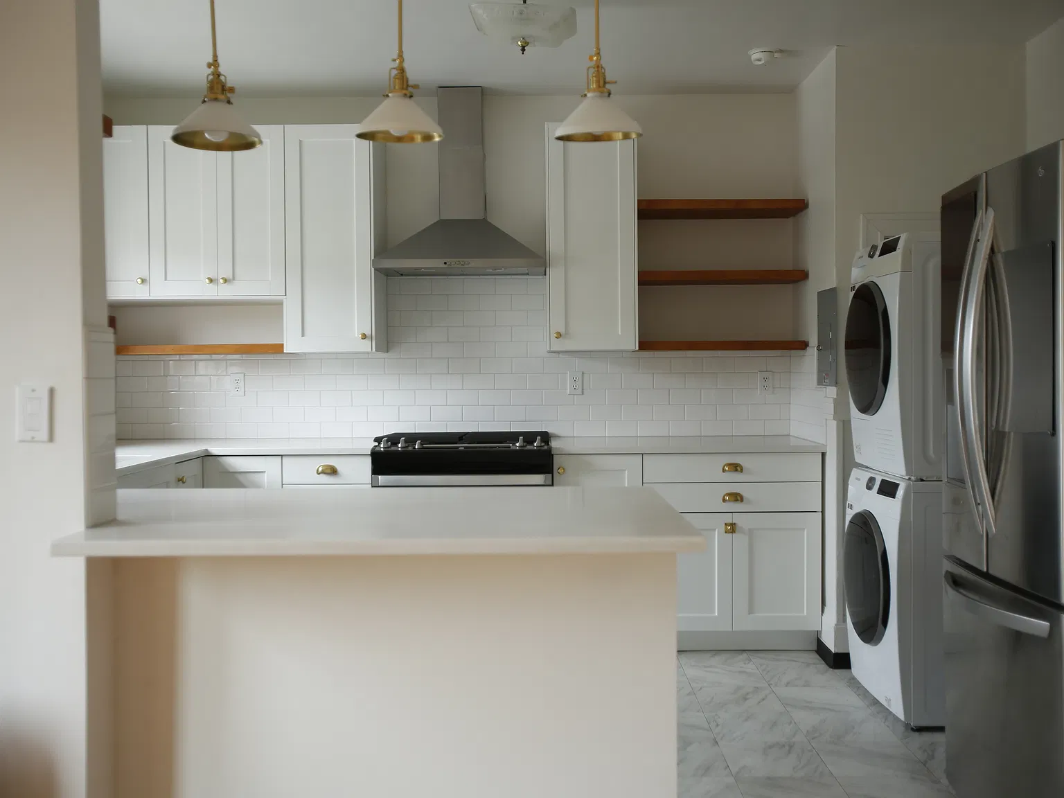 Kitchen with washer/dryer and fridge