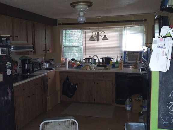 Kitchen has bay windows.
