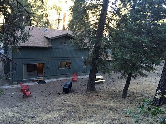 Large backyard with trees, fenced.