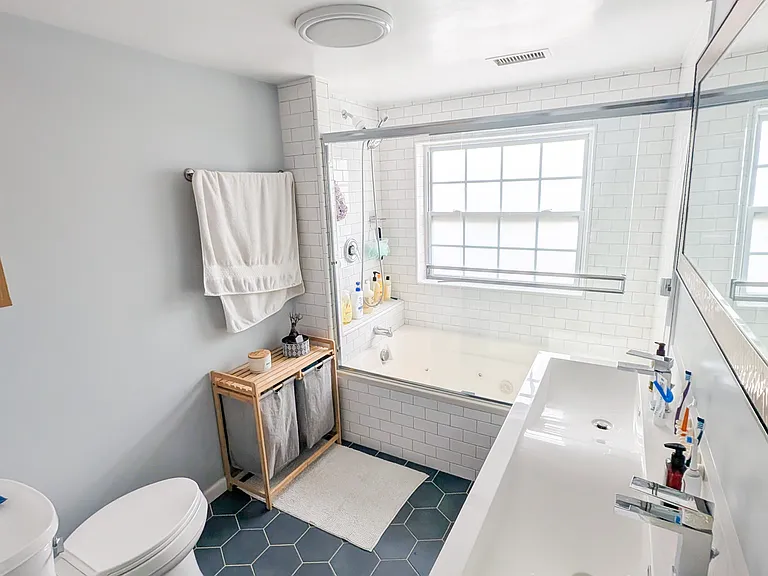 double sinks and full bathroom view