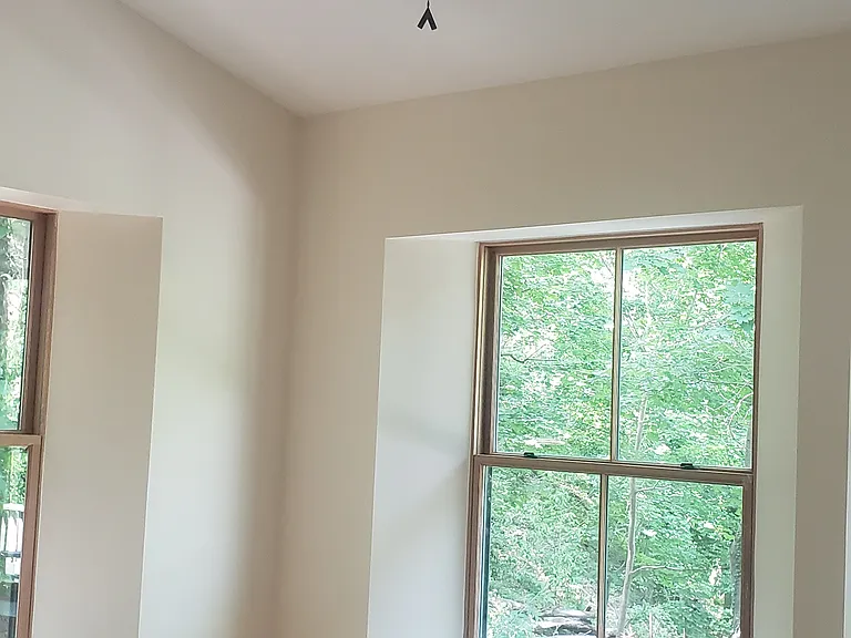 Second bedroom with fan.