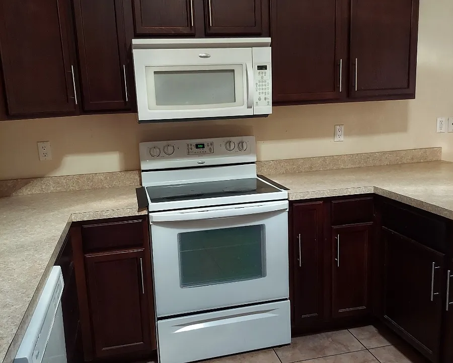 Kitchen with dishwasher, Stove, Microwave and stainless steel Refrigerator