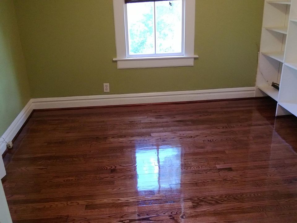 The 2nd bedroom with inbuilt book shelves and a walk in ligh