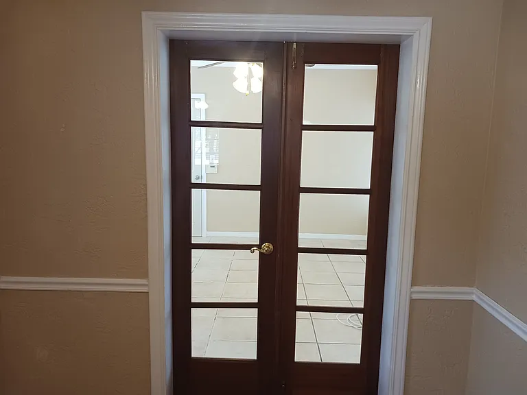 View of Florida room from dining area with doors closed.