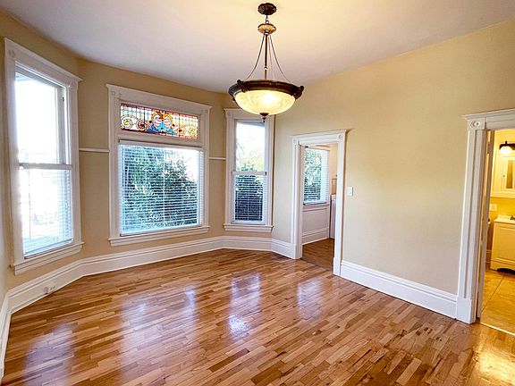 Original Hardwood Floors, Ornate Lighting and Trim