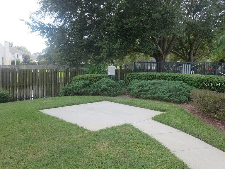 BARBEQUE AREA IN THE COMMON AREA NEXT TO THE COMMUNITY POOL