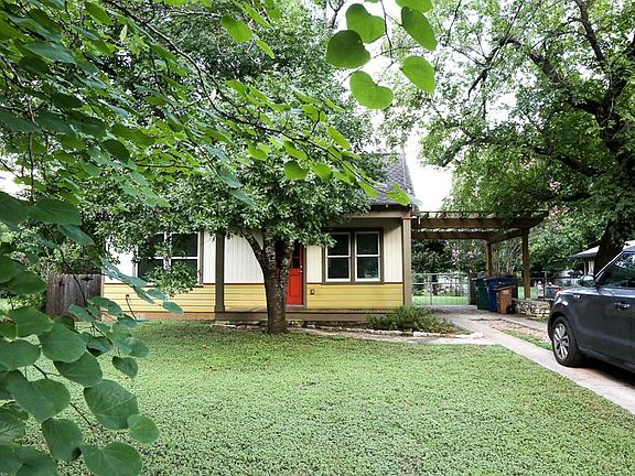 Off-street parking, Mexican plum tree in the front. House colors have been updated in 2025.