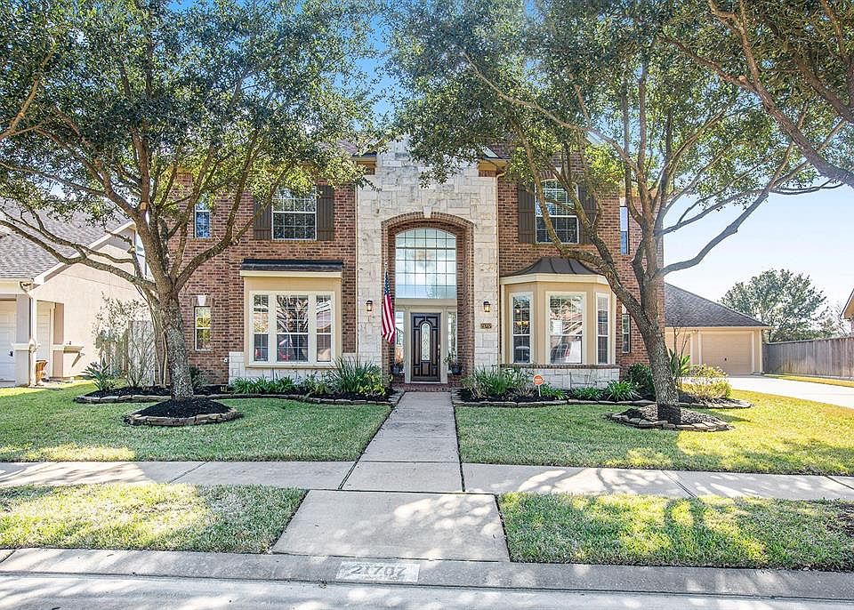 Welcome home to 21707 China Green nestled on a lake lot in the master planned community of Fairfield!