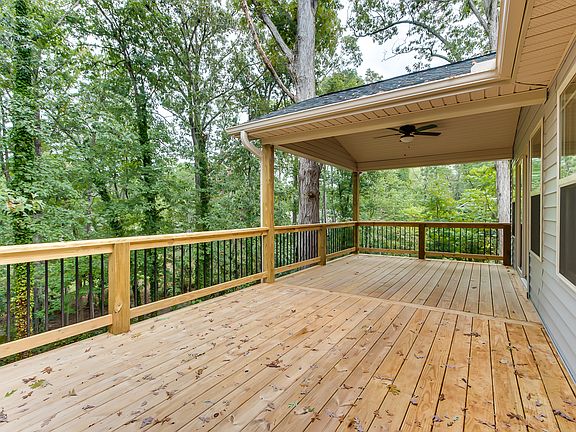 Direct access from the master bedroom to the covered deck. The rest of the deck is open to soak up the sun.