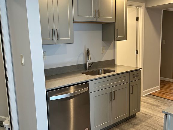 Front entry, kitchen, bathroom door way and lead into bedroom 1 and living room