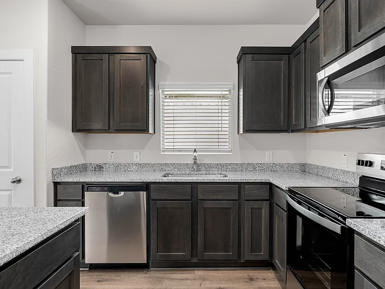 The kitchen has stainless-steel, energy-efficient appliances.