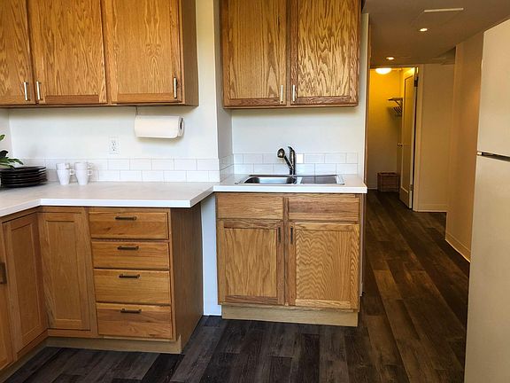 Kitchen + Hallway to bathroom, dining nook and private laundry room.