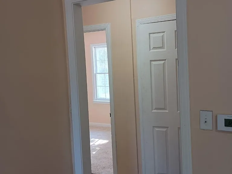 View from living room looking into hallway and bedrooms area