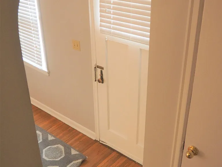 Front door and living room from staircase