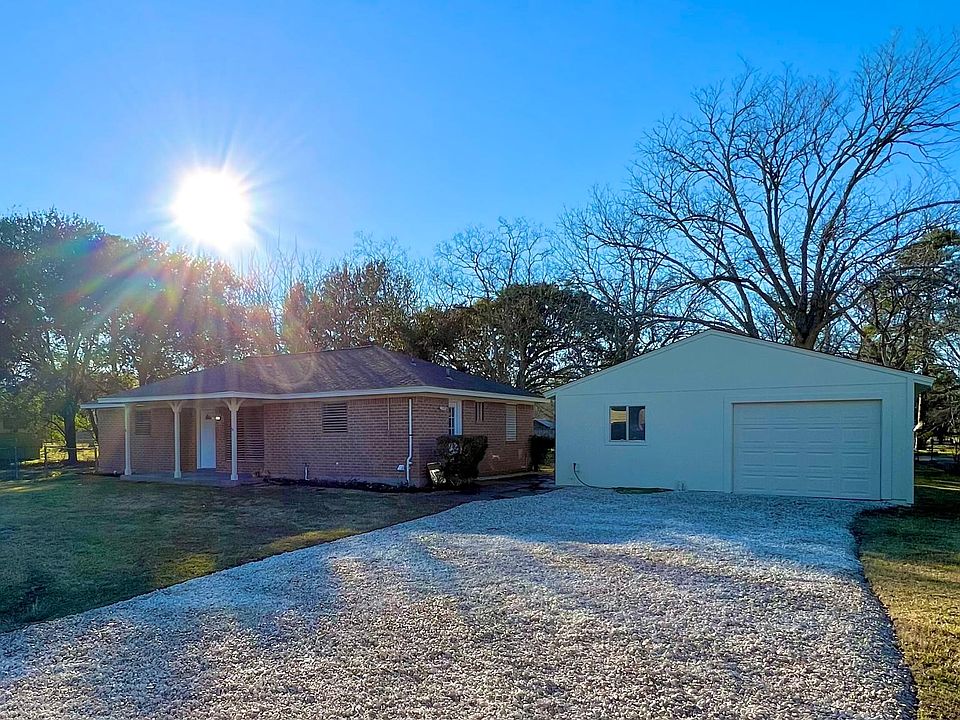 Full brick house, with beautiful large front and backyard, 2 car garage with driveways in front and back of house.