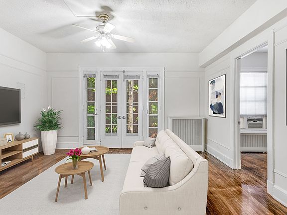 One-bedroom apartment living area (virtually staged)