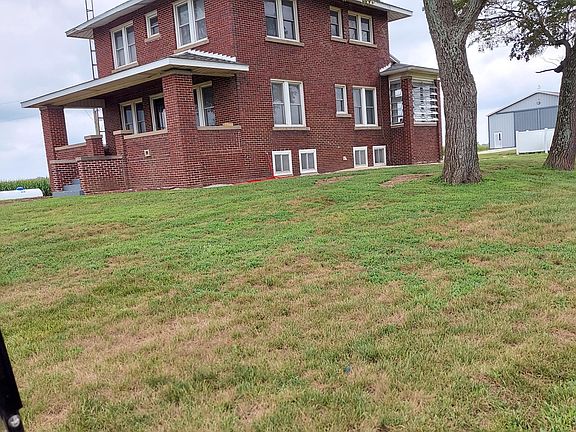 SIDE VIEW WITH SCREENED IN PORCH.