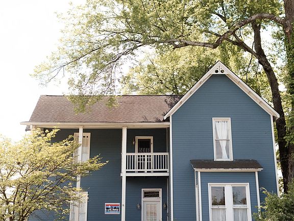 Front of home; new landscaping not depicted