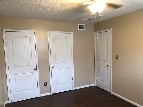 Bedroom #1. Two closets, ceiling fan, hardwood laminate flooring.