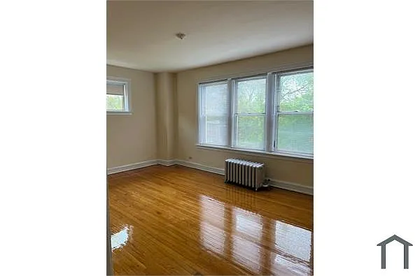 Building Photo - 7618 S Colfax Ave #1