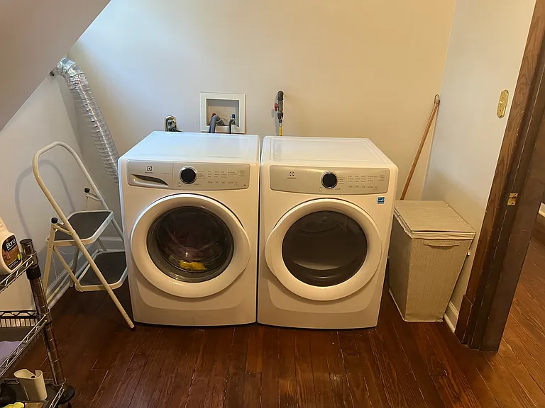 Separate spacious Laundry Room with HIgh Efficiency Front Load Washer and Dryer