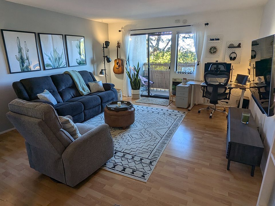 Open layout with enough room for a couch, a chair, a big-screen tv, and a desk with a window view!