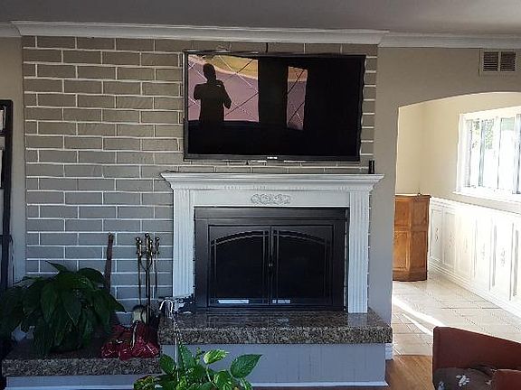 flatscreen over fireplace