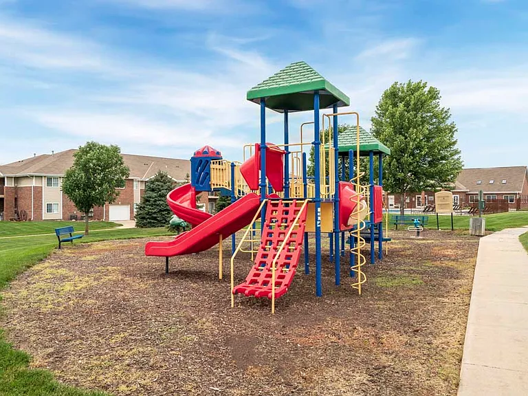 Play area with plenty of equipment to enjoy outdoors.