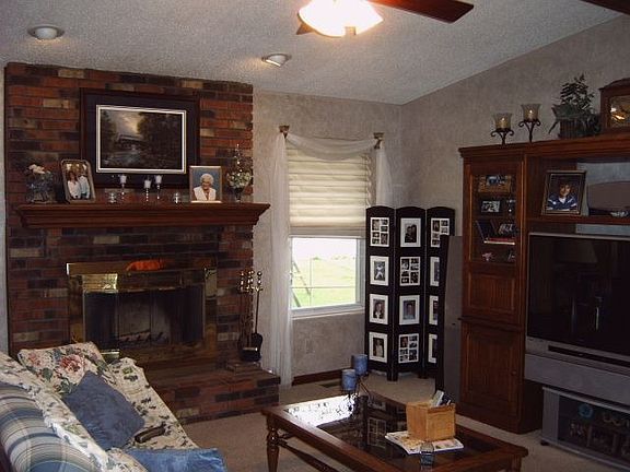 Great room with vaulted ceiling and fireplace