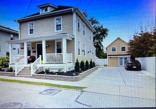Small house in the rear of this photo is the home in mention called the Carriage house rents for $1500/MO