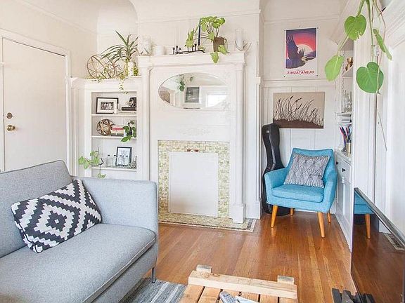 period charm including built ins, fireplace, and colums