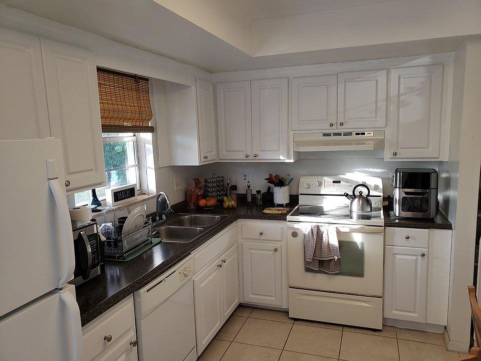 Kitchen with tile floor and room for a table and chairs