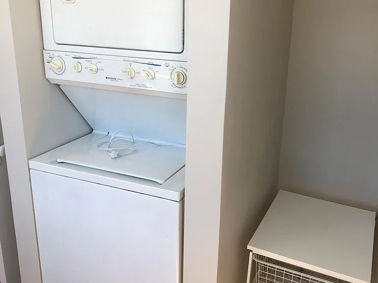 Washer and dryer in separate room off the kitchen.