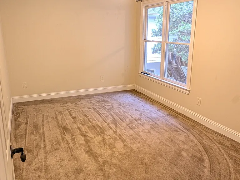 Bedroom off second floor hallway.