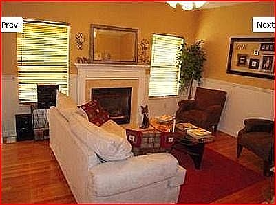Living room with wood floors and gas fireplace