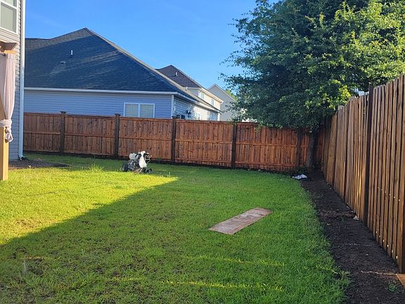 Backyard with privacy fence.
